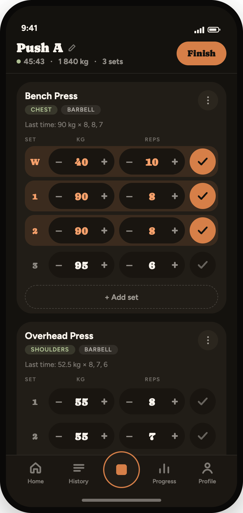 GymTrack active workout screen with pre-filled sets and completed rows in accent colour